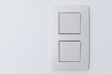 Close up of wall double light switch. Place for text