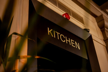 Kitchen sign on a door in the restaurant
