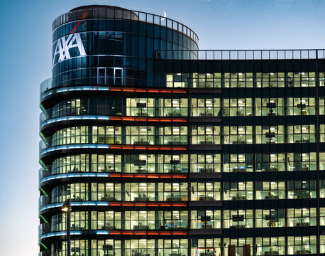 AXA insurance company offices illuminated in the evening hours.Porta Nuova district,Milan - Italy,16 December 2023