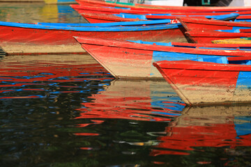 colorful painted rowboat in  Phewa lake in nepal, pokhara