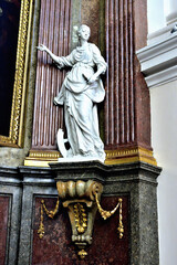 Statue of a saint in the gothic cathedral of saint peter and paul in Brno.