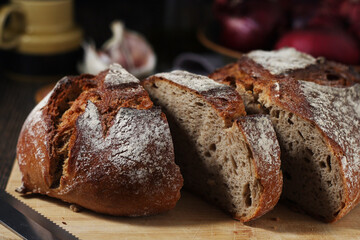 A loaf of rye bread in low key	