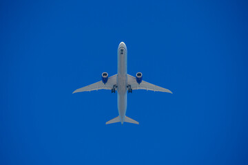 View of an airliner before landing against the blue sky
