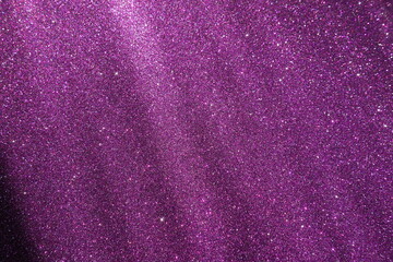 Oblique rays of light on a purple lilac surface. Bokeh, dust particles, reflection magical glow....