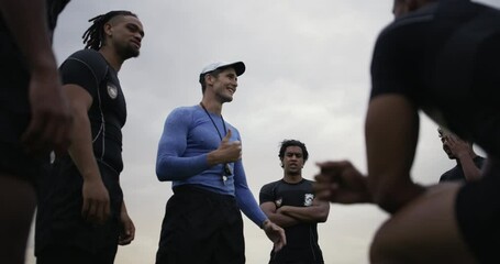 Men, team coach and sports on field for discussion, planning or strategy in game, contest or training. Group, people and athlete in circle, low angle or huddle for mentorship, challenge or diversity