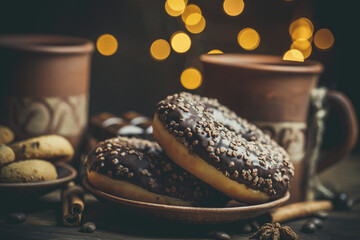 Beautiful mug with coffee and chocolate donuts on a beautiful background, holiday treats