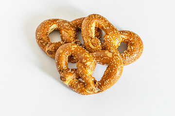 food background of pretzels on a white surface close up