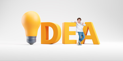 Boy with thumb up near yellow word idea with light bulb