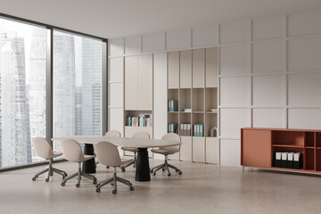 Beige office interior with negotiation table and seats, sideboard and window