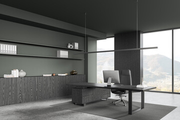 Grey office interior with ceo workspace near window, pc monitor and sideboard
