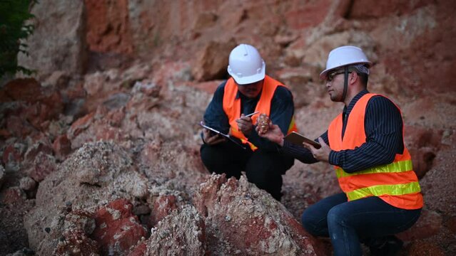 Geologist surveying mine,Explorers collect soil samples to look for minerals.