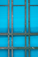Abstract rendering of metal bars and blue plastic