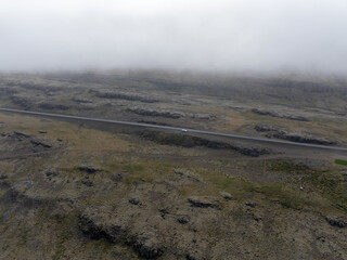 A car in the wilderness in foggy weather in Iceland