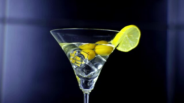 Refreshing aperitive drink . Dry Martini cocktails with ice cube	
