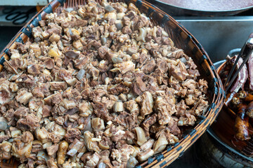 Cooked lamb in a bamboo basket