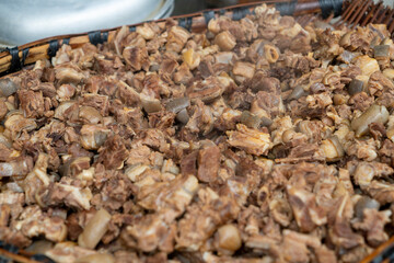 Cooked lamb in a bamboo basket