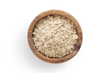 A top view of oat flakes in a wood bowl on white background