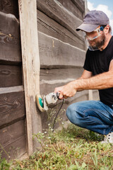 Rough cleaning and blanching of old boards - renovation of garden fence slats - rough male labor