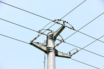 Electric steel poles in the blue sky background