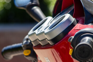  Detailed closeup of a scooter handlebar with speedometer