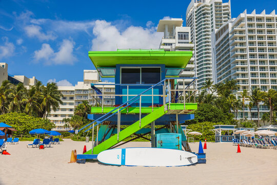 View of the sandy beach in Miami Beach with a lifeguard station against the backdrop of hotels. USA.