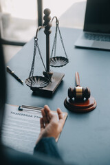 Justice and law concept.Male judge in a courtroom with the gavel, working with, computer and...