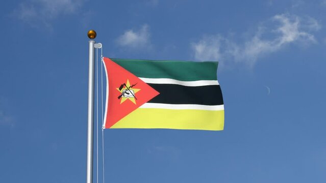 Mozambique flag flying on a flagpole