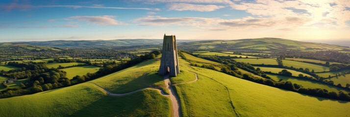 Aerial view of Glastonbury Tor near Glastonbury in the English county of Somerset, topped by the roofless St Michael's Tower, UK. Ai Generative. - obrazy, fototapety, plakaty