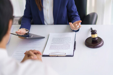 Lawyer woman use tablet and explaining about business contract and legal agreement with businessman