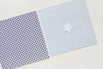 Fototapeta premium square paper tiles with plaid grid and stripes with small white star on blank paper