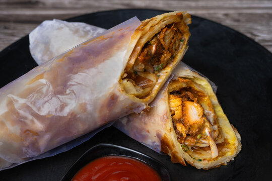 Serving of the paneer chicken roll. fast food dish