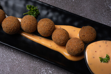 Potato cheese balls is a popular snack, made out of mashed potato stuffed with elegant stick of cheddar cheese, mixed with pepper and salt. Mayonnaise