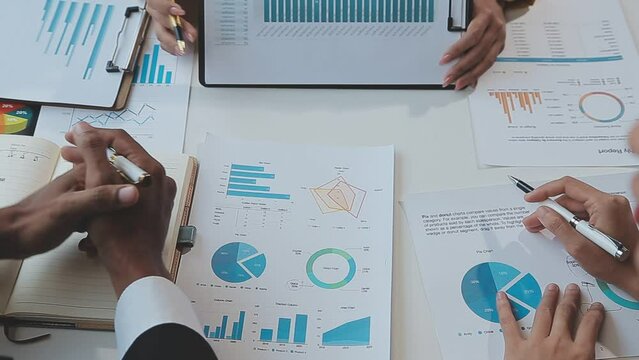 .Business team working with new startup project plan and discussion information for financial strategy with laptop and digital tablet in a modern business lounge.