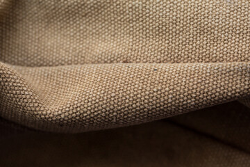 Sand colored fabric surface for clothing production, brown fabric