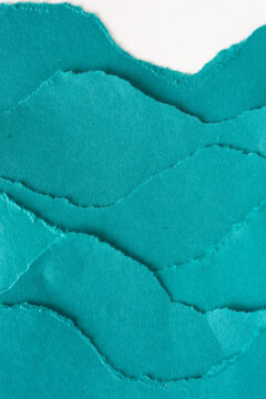 undulating paper shapes with overlapping torn edges on white