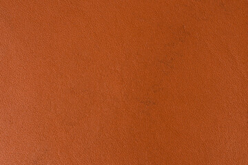 Texture of bright orange full grain leather
