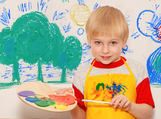 Portrait of a little artist at school
