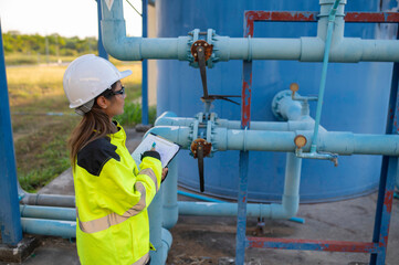 Environmental engineers work at wastewater treatment plants,Female plumber technician working at...