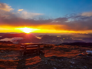 Panoramic sunrise view from summit Dobratsch on Julian Alps and Karawanks in Austria, Europe....
