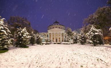 Winter snowfall night photo in Bucharest. Beautiful evening wide angle view during a snowfall over...