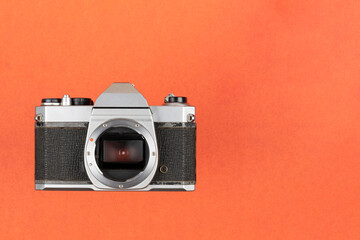 Vintage Film Camera isolated on red background