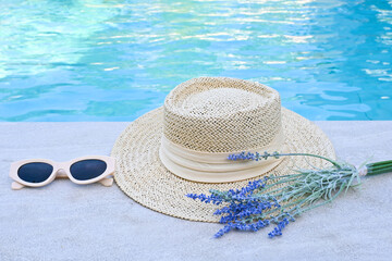 Straw hat, sunglasses, beside the pool party.