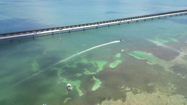 Aerial view of boats and island next to the Seven Mile Bridge near Marathon in the  Florida Keys, Monroe County, United States. 