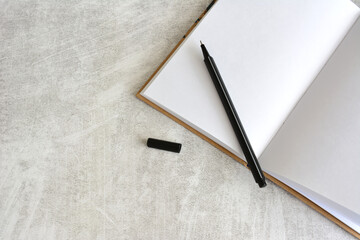 open notepad with black pen isolated top view  