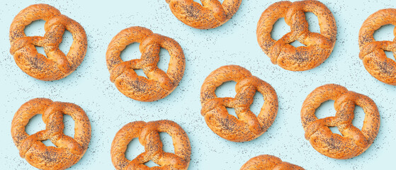 Many pretzels on light blue background. Pattern for design