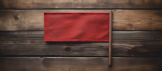 RED flag concept. Hand hold small flag on dark wooden background.AI Generative 