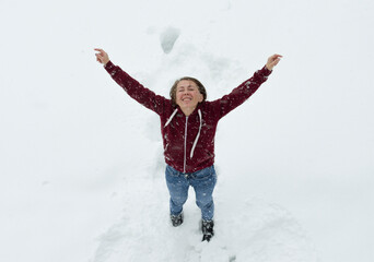 Fototapeta na wymiar girl playing with snow