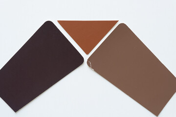 grungy brown paper shapes on white