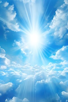 Bright blue sky with sun rays shining through clouds
