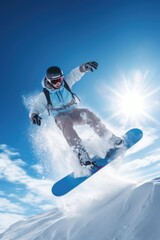 A man riding a snowboard down a snow covered slope. Perfect for winter sports and adventure-themed designs
